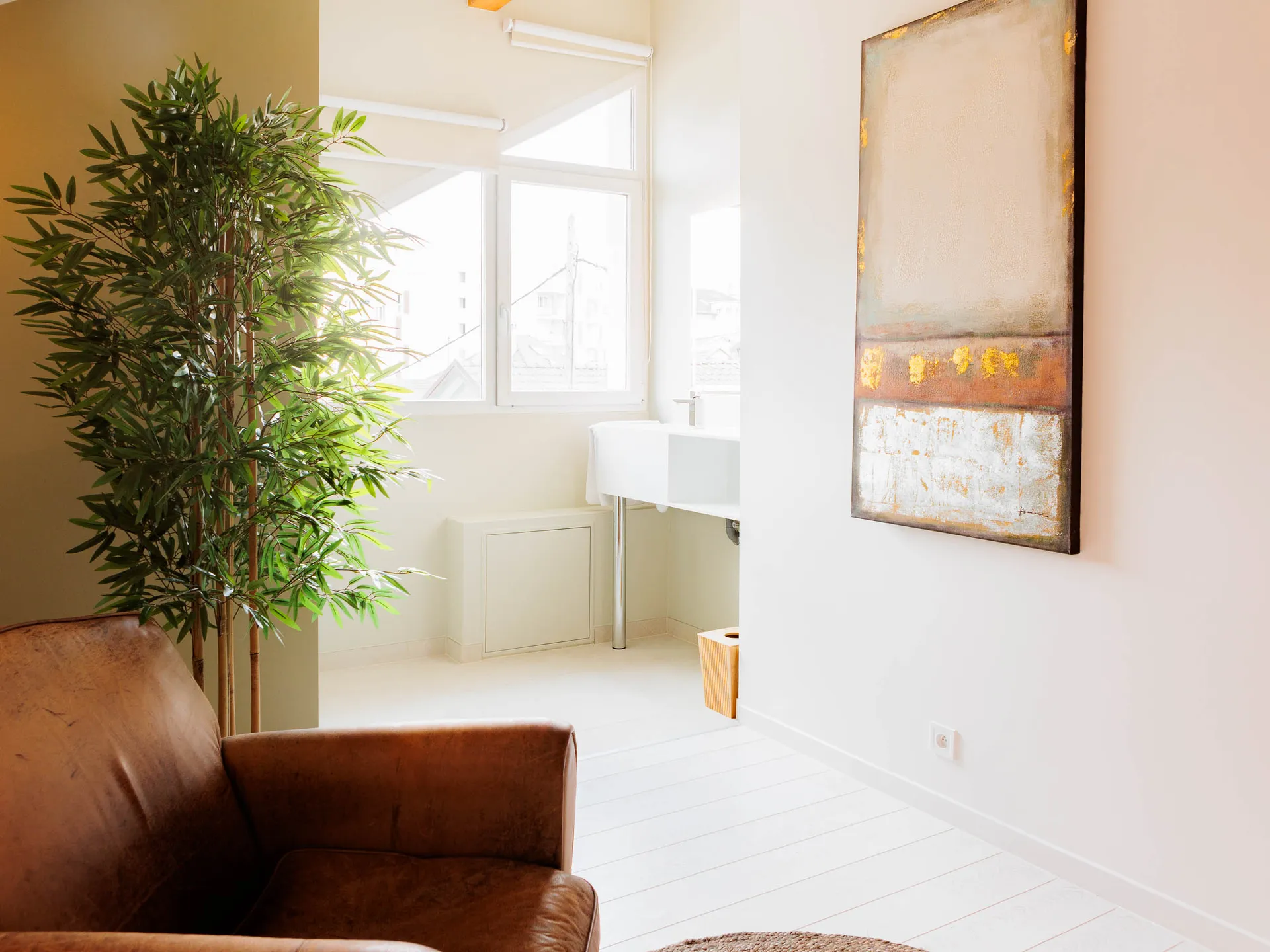 Room 4 — natural light, plant and large painting